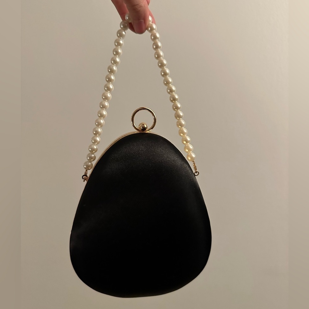 structured clutch black satin pearl gold chain and ring handle